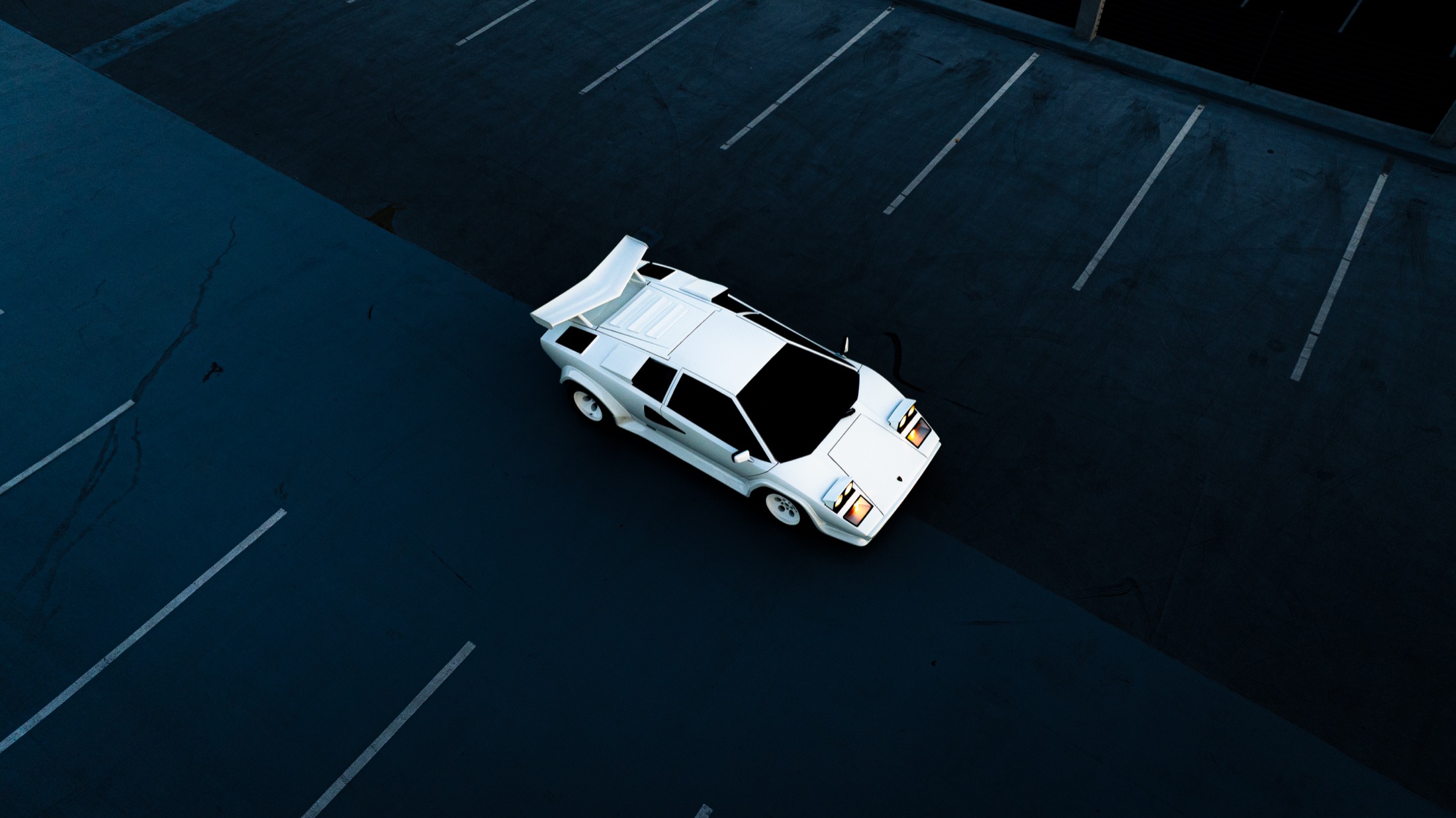 Aerial shot of a car in a parking garage